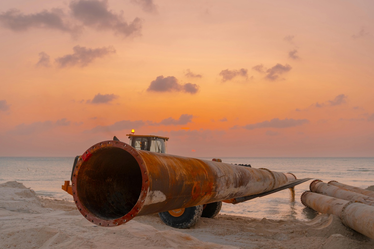 oil pipeline at sunset